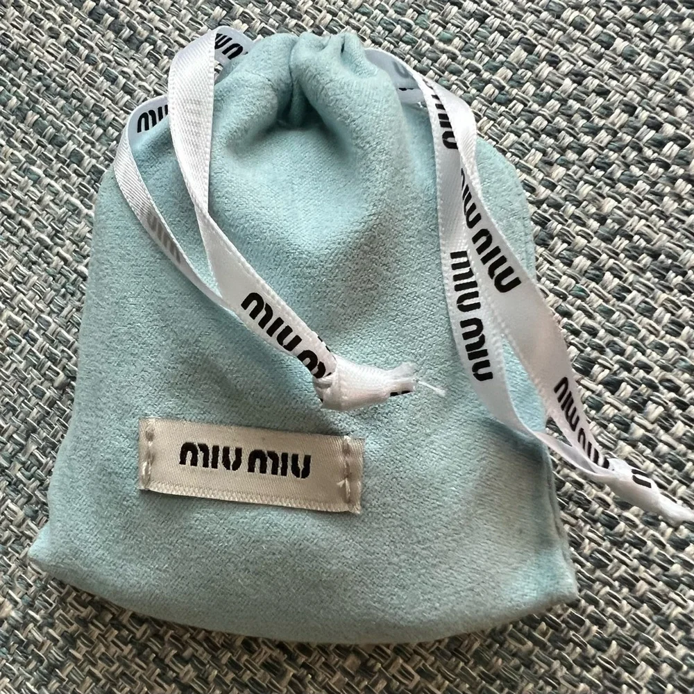 39. Miu Miu Turquoise Compact Case